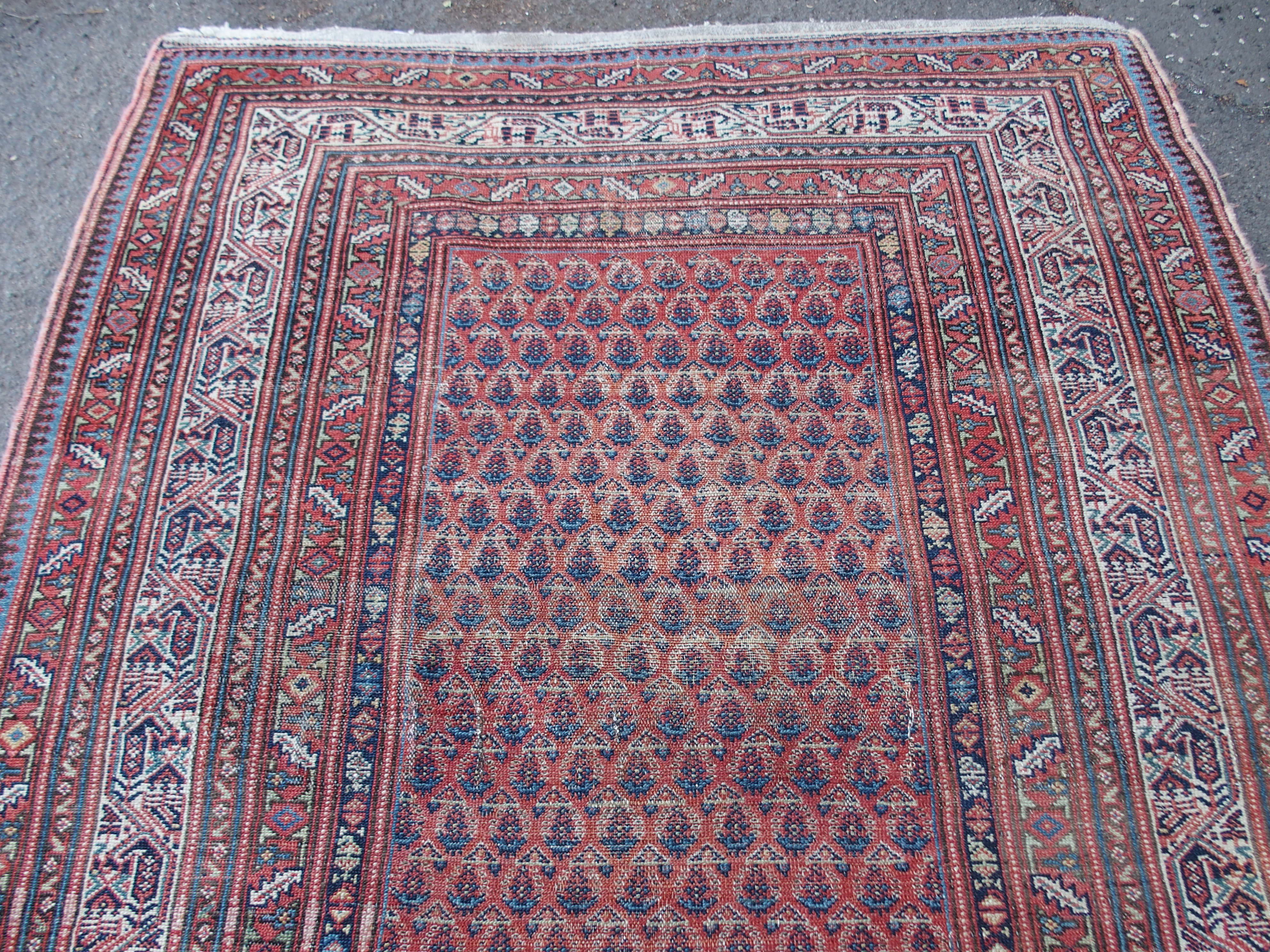 AN ARAAK RED GROUND RUG with multiple borders, 320cm x 150cm and an Eastern rug with four central - Image 5 of 10