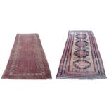 AN ARAAK RED GROUND RUG with multiple borders, 320cm x 150cm and an Eastern rug with four central