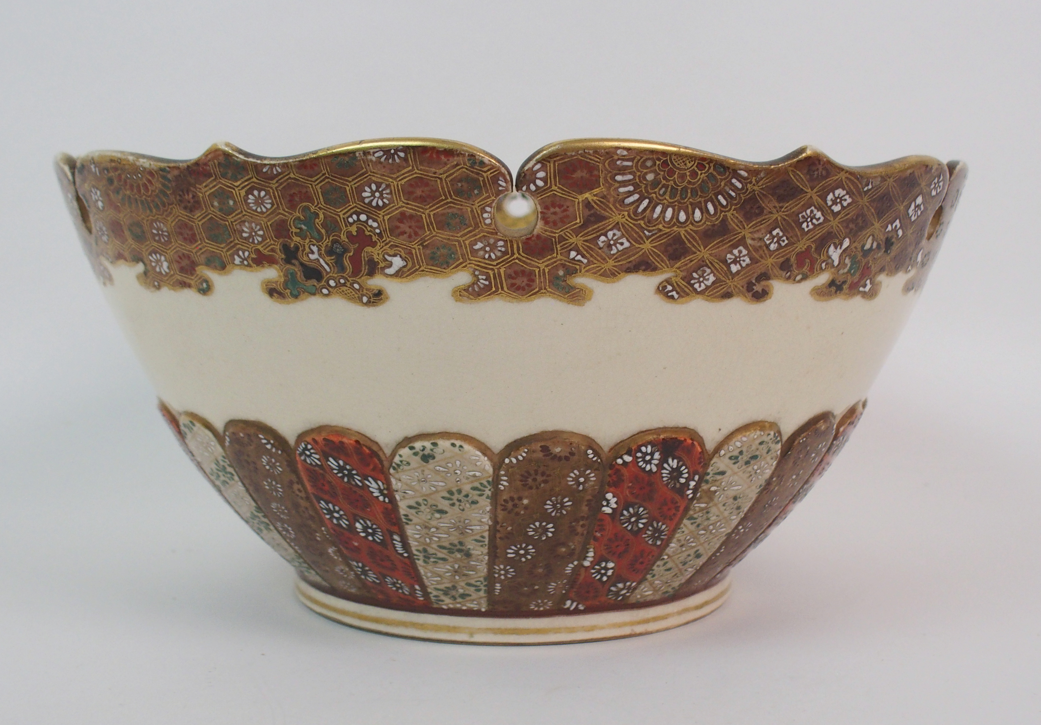 A SATSUMA BOWL painted with figures in a garden within gilt brocade border and pierced foliate - Image 7 of 10