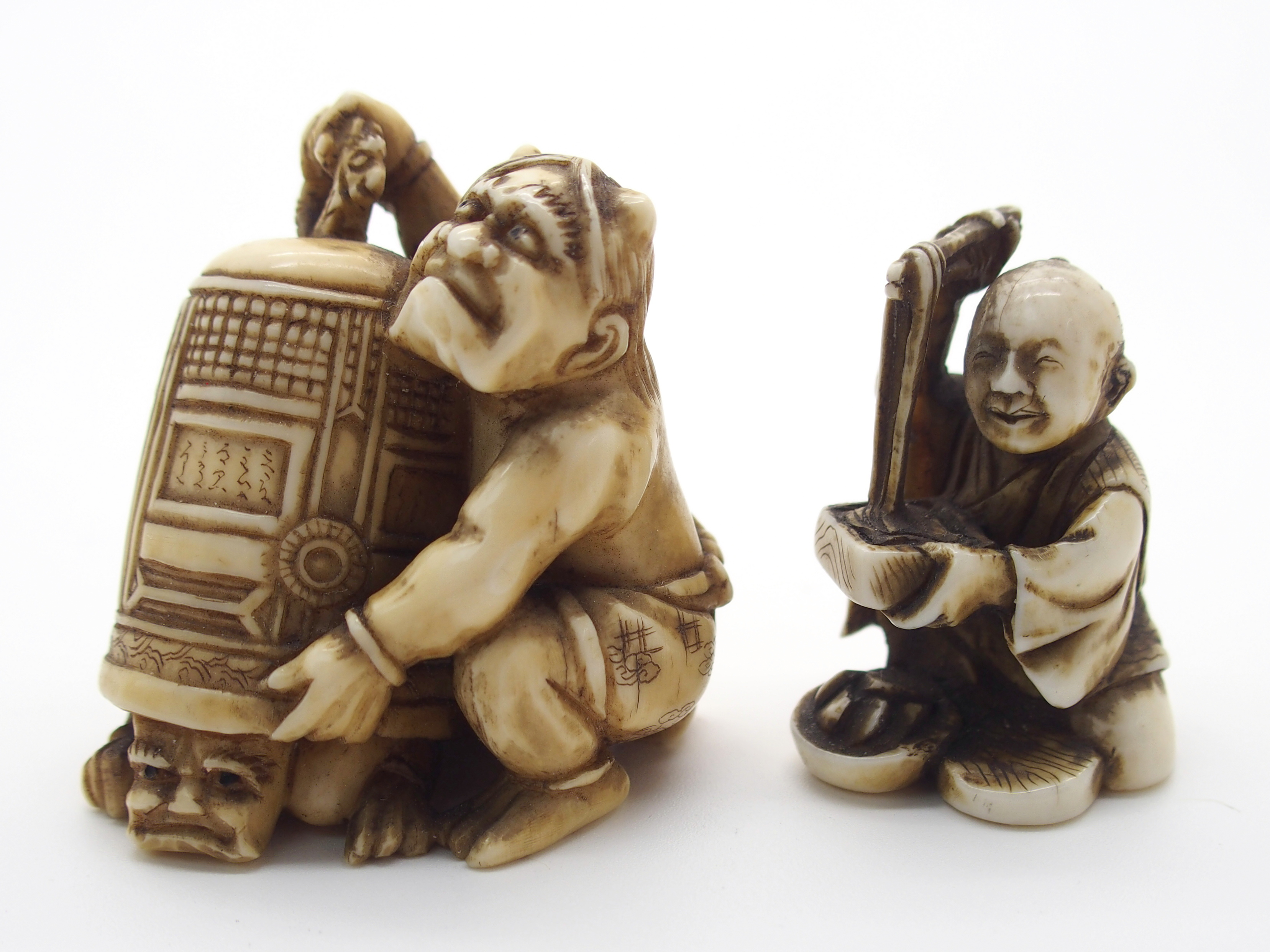 A JAPANESE IVORY OKIMONO ONI holding a temple bell enclosing another demon, 5cm high, a netsuke of a - Image 2 of 10