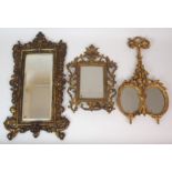 A GILT-GESSO MINIATURE PORTRAIT DUET FRAME inset with mirror plates, acanthus carved, with loop