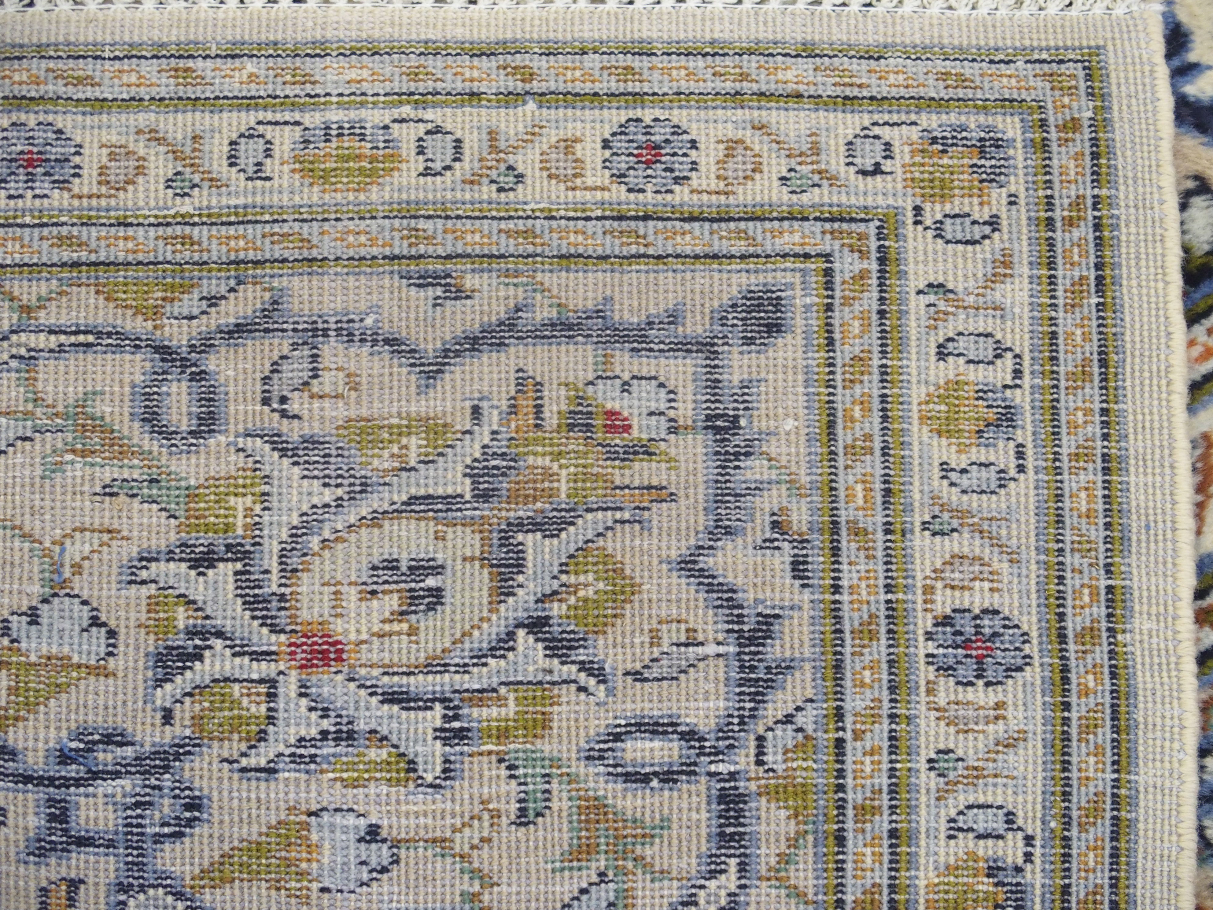 A CREAM GROUND KASHAN RUG with floral designs, central medallion and a border with floral palmettes, - Image 4 of 4