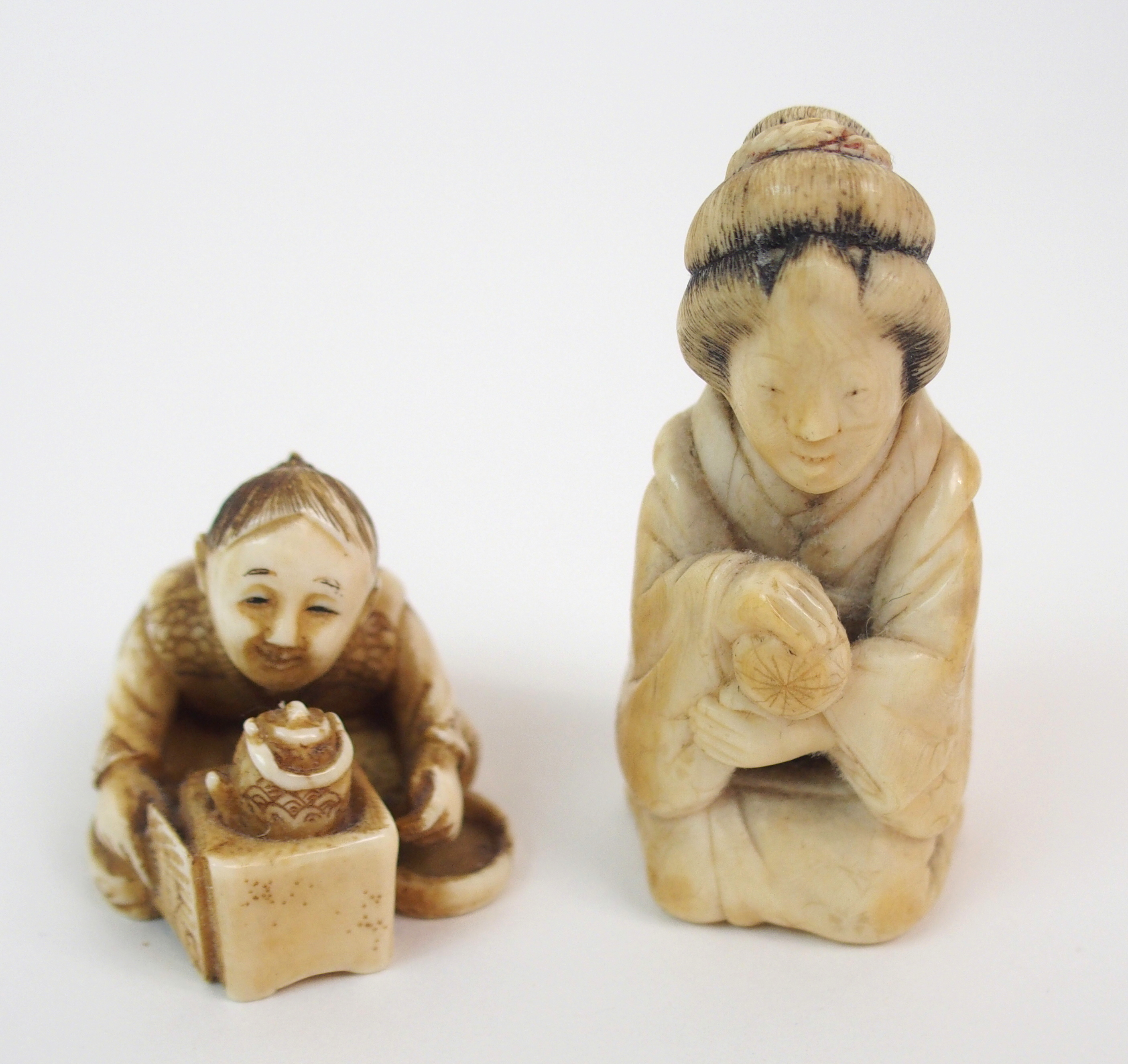 THREE JAPANESE IVORY NETSUKE one with a child seated with a kettle, 3cm high, figure with monkey, - Image 3 of 8