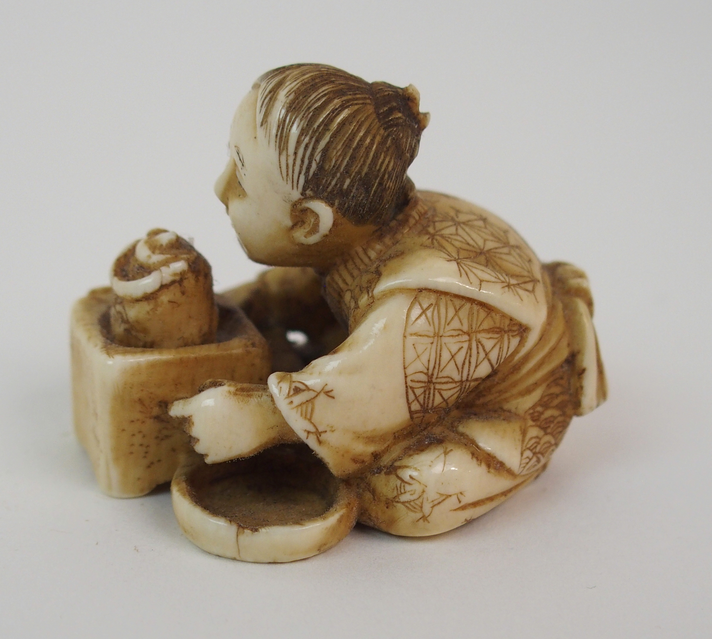 THREE JAPANESE IVORY NETSUKE one with a child seated with a kettle, 3cm high, figure with monkey, - Image 2 of 8