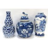 A blue and white double gourd vase, a prunus jar with matched cover and a vase decorated with