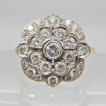 An 18ct yellow and white gold diamond flower ring set with estimated approx 0.60cts, finger size