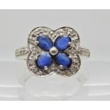 An 18ct white gold sapphire and diamond ring, sapphires approx 4.5mm x 3.5mm approx. Finger size