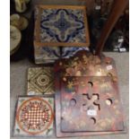 A quantity of Delft blue and white tiles, a transfer printed tile, lacquer letter rack etc