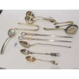 A lot comprising silver sauce ladles, sifter ladles, fancy serving spoon, tongs and a pair of silver