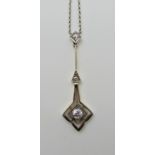 A yellow and white metal vintage diamond pendant largest diamond 0.15cts, length of chain 49cm,