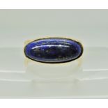 An 18ct gold retro ring set with a lapis lazuli, dimensions approx 16mm x 7.5mm, finger size