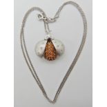 An 18ct white gold diamond and citrine set ladybird pendant and chain, pendant 2.2cm, chain 45cm,