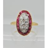 An 18ct gold ruby and diamond plaque ring, finger size N1/2, weight 2.6gms, with an insurance