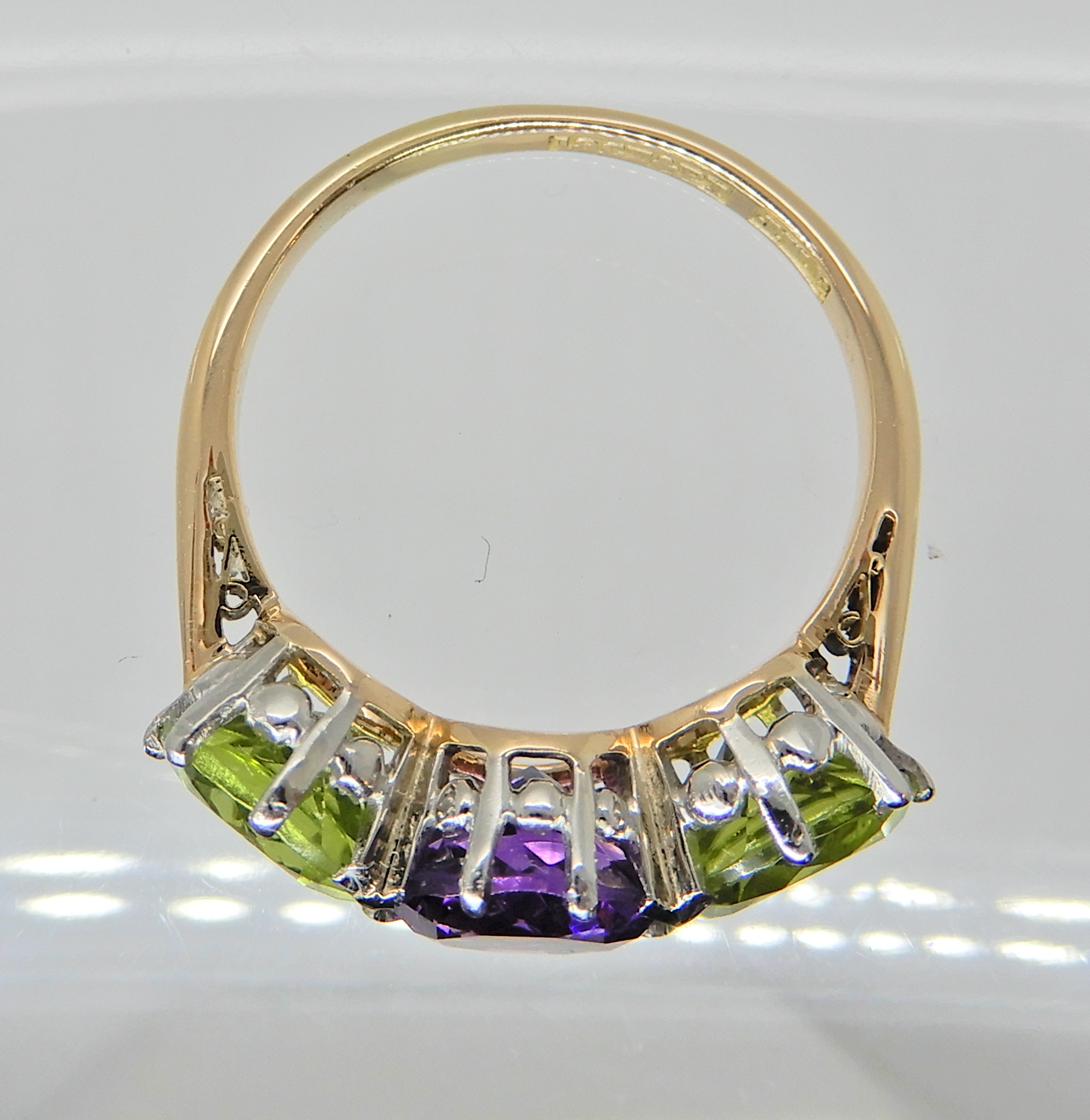 An 18ct gold and platinum peridot and amethyst three stone ring, Finger size N1/2 weight 4.1gms - Image 2 of 3