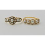 A bright yellow metal five pearl set ring with scrolled shoulders. Finger size O1/2, weight 3.