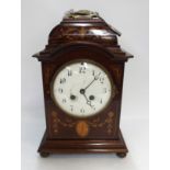 A French mahogany inlaid mantle clock, 30cm high