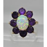 A 9ct gold opalite and amethyst ring, weight 3.5gms