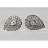 A pair of 18ct white gold pear shaped diamond cluster earrings designed by Iliana with an