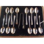 A cased set of twelve silver teaspoons with tongs, Sheffield 1925