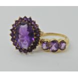 A 9ct gold amethyst set ring weight 4.1gms, together with a 9ct gold three amethyst ring, weight 2.