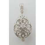 An 18ct white gold diamond set pierced open work pear shaped pendant, length 3.5cm, weight 6gms