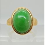 A 14ct gold Chinese green hardstone cabouchon signet ring, hardstone approx 13.5mm x 10mm x 4.9mm,