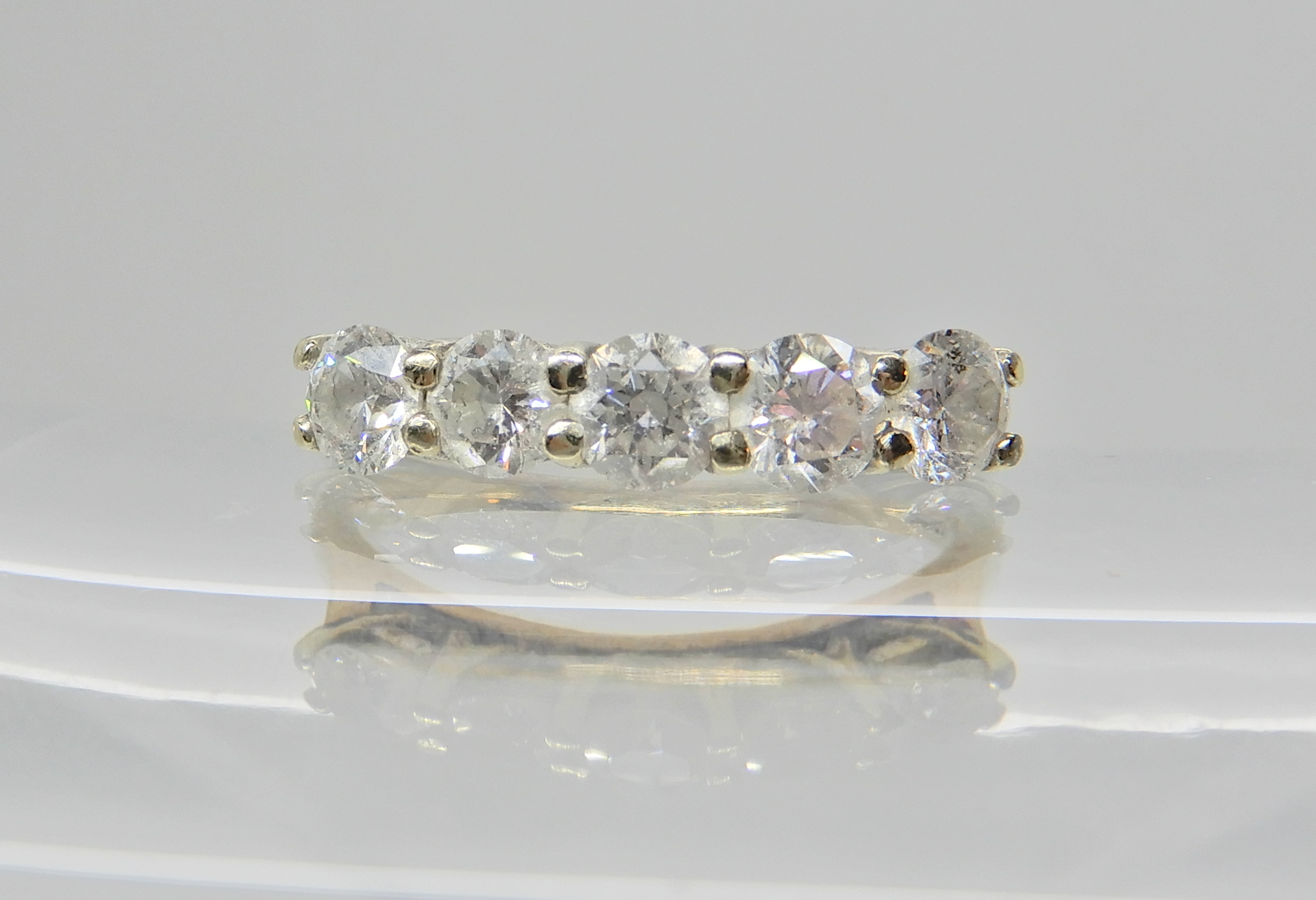 A 9ct gold five stone diamond ring of estimated approx diamond content 0.89cts, finger size O,