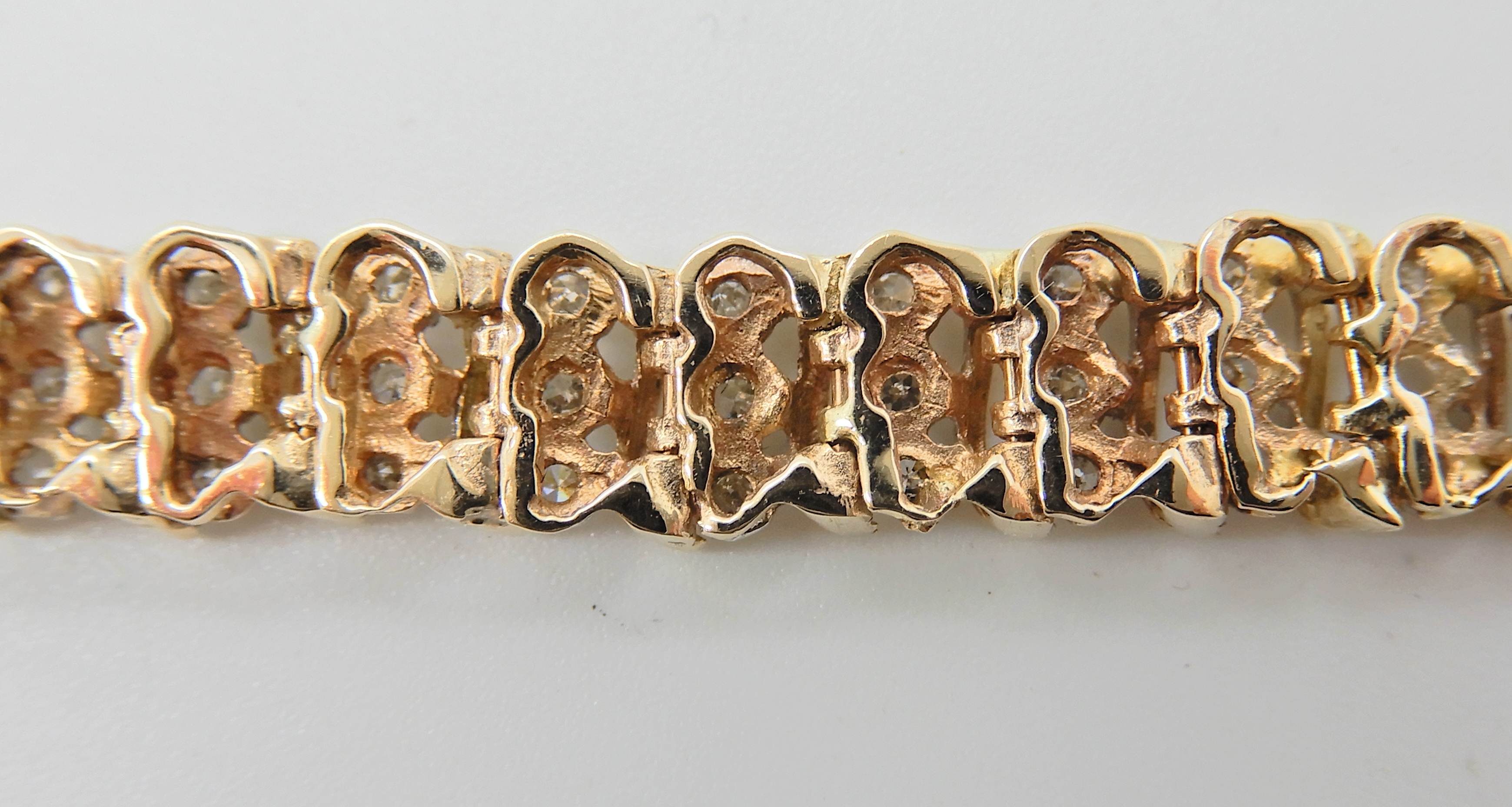 A 9ct gold diamond set bracelet, with 'S' shaped links, stamped 375 and the diamond content is - Image 4 of 4