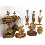 A pair of gilded metal gem set candelabra, similar inkwell together with a pair of lidded urn