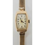 A 9ct gold vintage Rolex with a chevron designed dial, with an extendable woven 9ct watch strap,