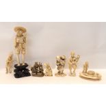 An ivory okimono of a fisherman and five other ivory figures