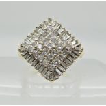 A 9ct gold baguette and brilliant cut diamond cluster ring with an estimated approx diamond