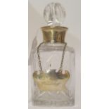 A small whisky decanter with silver collar, Birmingham 1988 with a decanter label "Mac's Whisky",