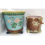 A majolica jardiniere depicting squirrels in flowering trees together with another decorated with
