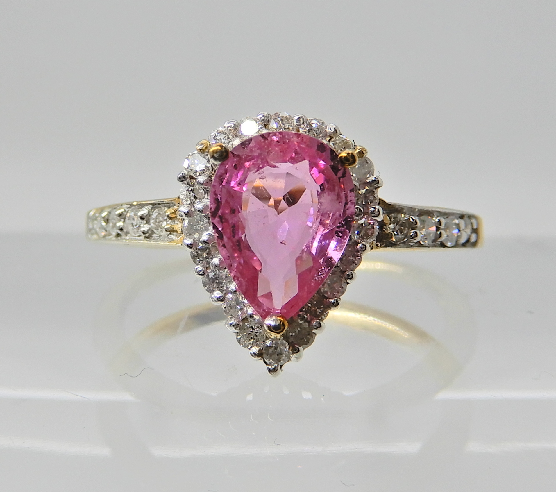 A 9ct gold pear shaped pink sapphire and diamond ring finger size O Condition Report: