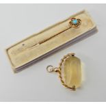 A 9ct gold citrine fob seal and a yellow metal turquoise set pin Condition Report: