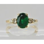 A 9ct gold green gem and diamond ring, finger size O, weight approx 3.4gms Condition Report: