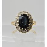 A 9ct gold sapphire and diamond cluster ring, finger size M1/2, weight approx 4gms Condition Report: