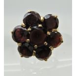 A 9ct gold garnet cluster ring, finger size L, weight approx 4.4gms Condition Report: