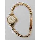A 9ct gold Accurist ladies watch and strap weight approx with mechanism 13.5gms Condition Report: