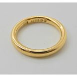An 18ct gold wedding ring dated Birmingham 1928, finger size H, weight 3.3gms Condition Report: