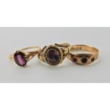 A 9ct garnet set ring finger size N, a yellow metal Victorian ring with red foiled back gem,