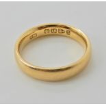 An 18ct gold wedding ring finger size L, weight 4.7gms Condition Report: