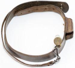 LNWR Policeman’s whistle on a leather bandolier type strap with integral whistle pocket. Brass