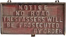 Wooden sign NOTICE NO ROAD TRESPASSERS WILL BE PROSECUTED BY ORDER, maybe of railway origin.