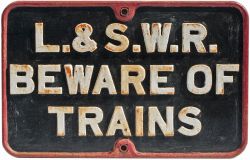 LSWR cast iron sign BEWARE OF TRAINS. In lightly restored condition measures 26in x 16.5in. Ex