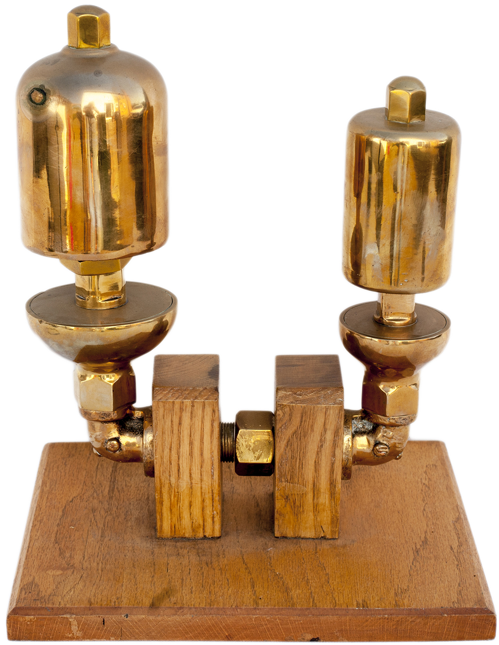 GWR brass locomotive whistles large and small tastefully mounted on an oak display stand.