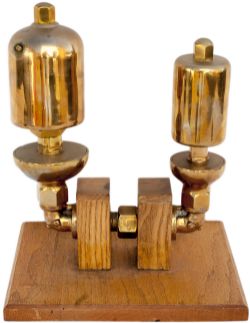 GWR brass locomotive whistles large and small tastefully mounted on an oak display stand.