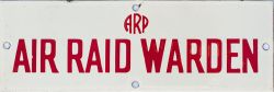 Enamel sign ARP AIR RAID WARDEN, white on red. Measures 9in x 3in and is in excellent condition.