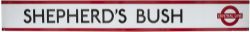 London Underground enamel frieze sign SHEPHERD'S BUSH with central line logo measuring 75.5in x 9in.